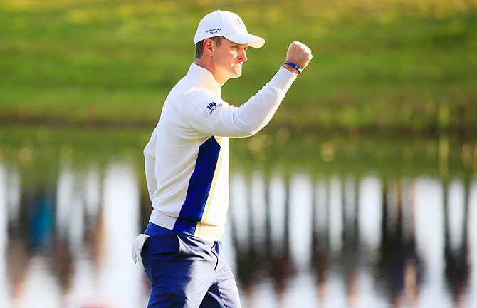 Justin Rose of Europe celebrates his putt on the 2nd green during the Morning Fourballs of the 2014 Ryder Cup on the PGA Centenary course at the Gleneagles Hotel in Auchterarder, Scotland on Friday