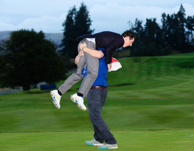 Rory McIlroy of Europe celebrates winning the Ryder Cup after the Singles Matches