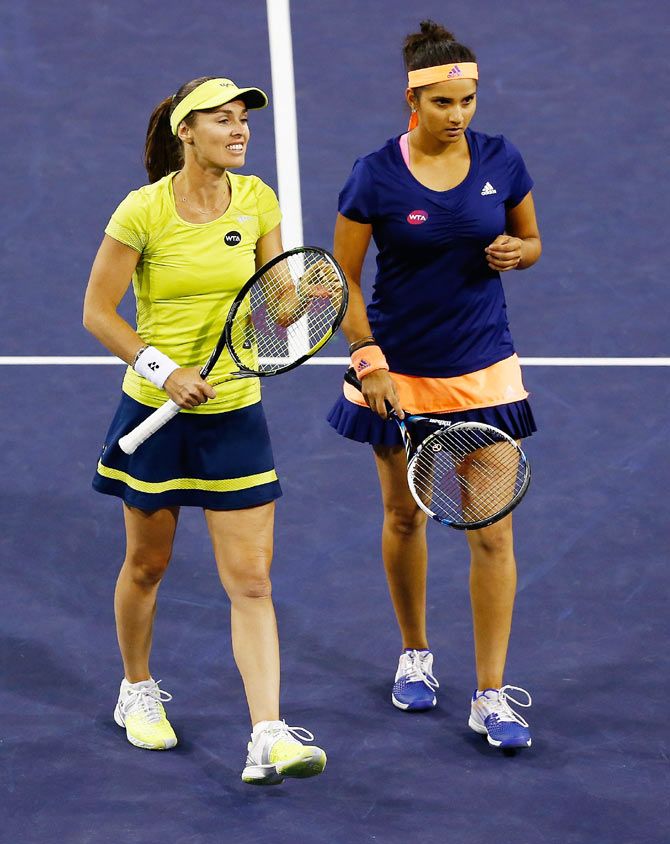 Sania Mirza (right) and her Swiss partner Martina Hingis