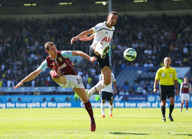 Ashley Barnes of Burnley and Nabil Bentaleb of Spurs battle for the ball during their match at Turf Moor in Burnley on Sunday