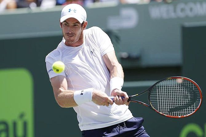 Andy Murray hits a backhand against Novak Djokovic 