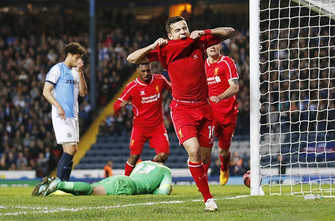 Philippe Coutinho celebrates after scoring the first goal for Liverpool in the FA Cup quarter-final against Blackburn Rovers on Wednesday