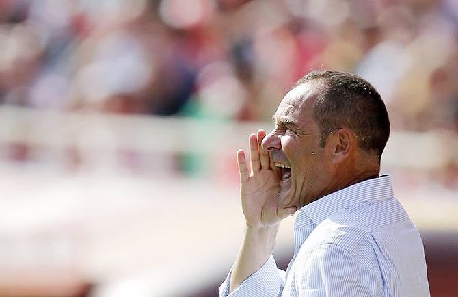 Deportivo Coruna's coach Victor Fernandez shouts out instructions