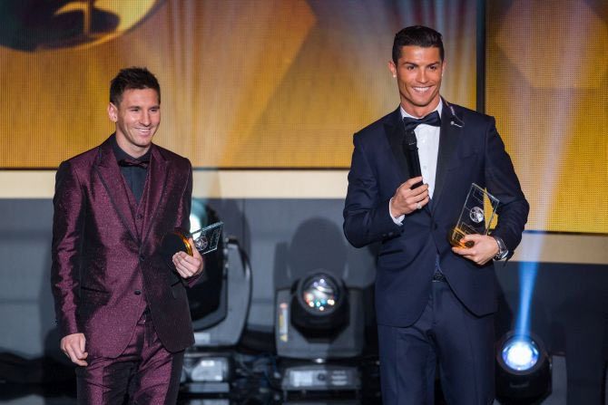 FIFA Ballon d'Or nominees Lionel Messi of Argentina and FC Barcelona (L) and Cristiano Ronaldo of Portugal and Real Madrid smile during the FIFA Ballon d'Or Gala 2014