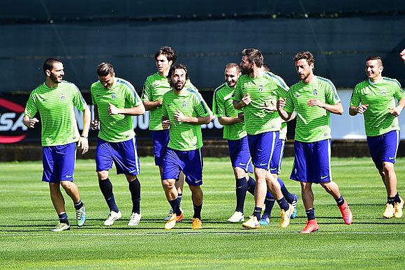 Juventus players go through the paces at a training session on the eve of their Champions League match at the 'Juventus Training Centre' in Vinovo near Turin, on Monday