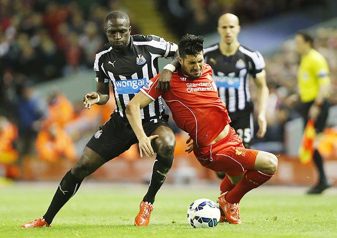 Newcastle's Moussa Sissoko and Liverpool's Emre Can in an intense challenge 