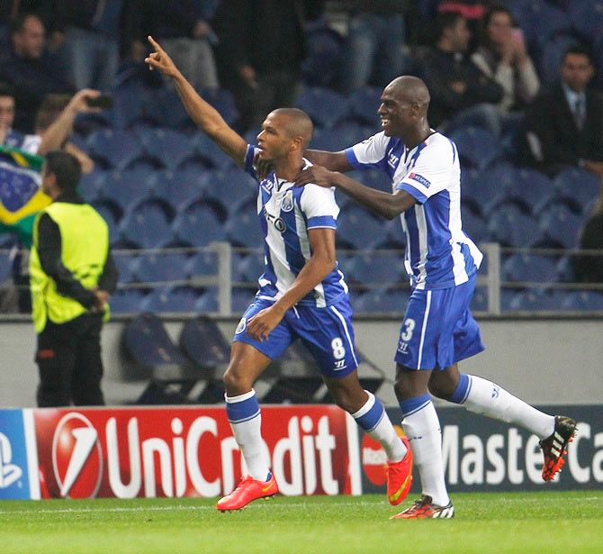 Porto's Yacine Brahimi (left) celebrates a goal with teammate Bruno Martins