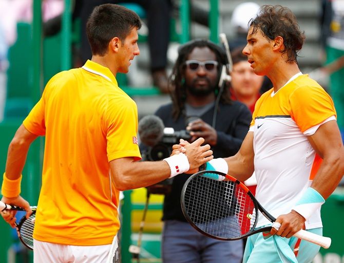 Novak Djokovic of Serbia is congratulated by Rafael Nadal of Spain