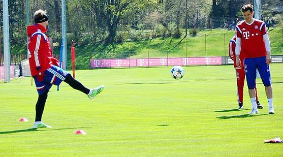 Bayern's Bastian Schweinsteiger (left) goes through the paces at a training session on Sunday