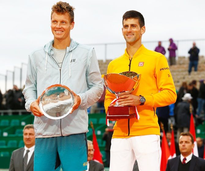 Novak Djokovic of Serbia with the winners trophy next to runner up Tomas Berdych
