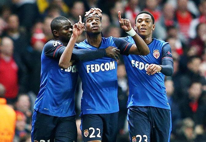 Geoffrey Kondogbia #22 (centre) of Monaco celebates with teammates after scoring the opening goal against Arsenal during the UEFA Champions League round of 16, first leg match at The Emirates Stadium in London