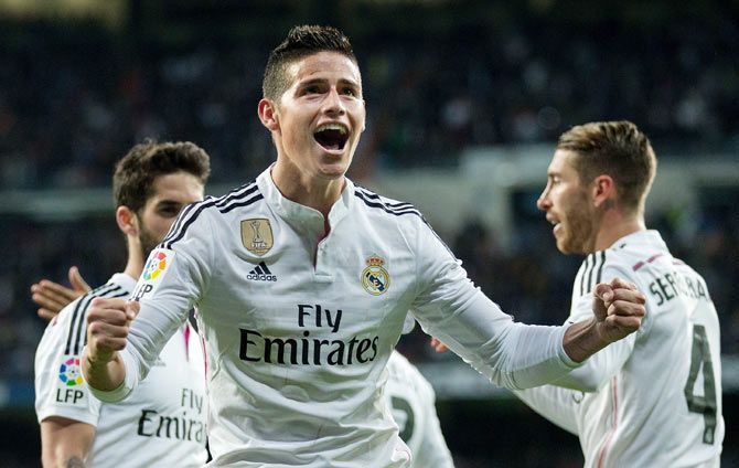 Real Madrid's James Rodriguez celebrates scoring their second goal with teammate Sergio Ramos (right)