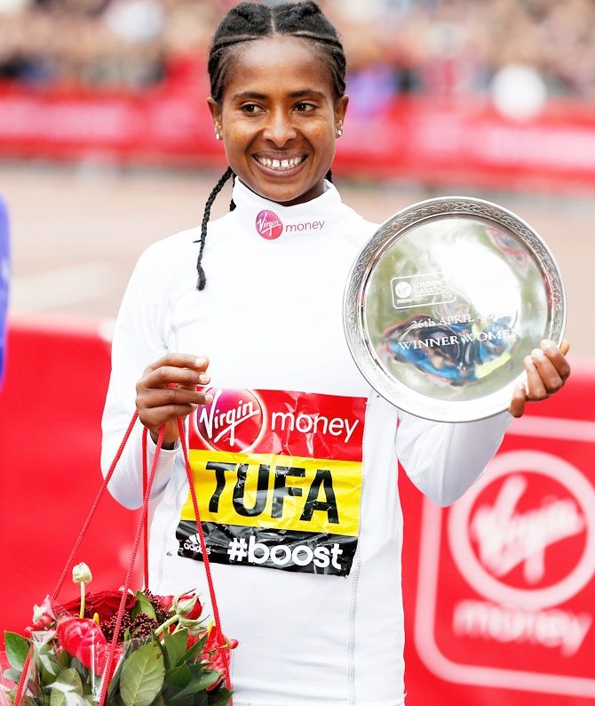 Women's race winner Tigist Tufa of Ethiopia celebrates 