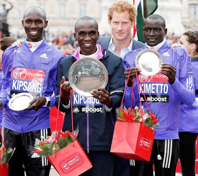 From left, Second placed Wilson Kipsang of Kenya, first placed Eliud Kipchoge of Kenya, Prince Harry and third placed Dennis Kimetto of Kenya