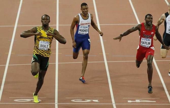 Jamaica’s Usain Bolt, left, celebrates