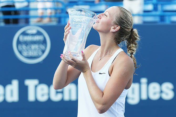 Czech Republic's Petra Kvitova kisses her trophy after defeating compatriot Lucie Safarova in the final of the Connecticut Open at Connecticut Tennis Center at Yale in New Haven on Saturday