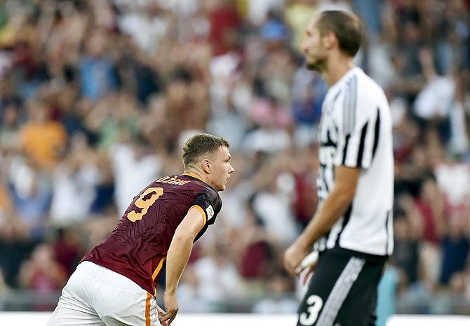 AS Roma's Edin Dzeko (left) celebrates after scoring against Juventus during their Serie A match at Olympic stadium in Rome on Sunday