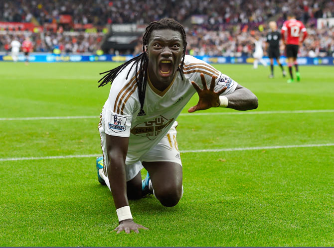 Swansea striker Bafetimbi Gomis celebrates after scoring the second goal against Manchester United during their Barclays Premier League in Swansea on Sunday