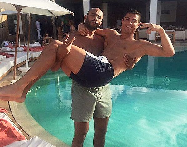Cristiano Ronaldo is carried by Moroccon boxer Badr Hari