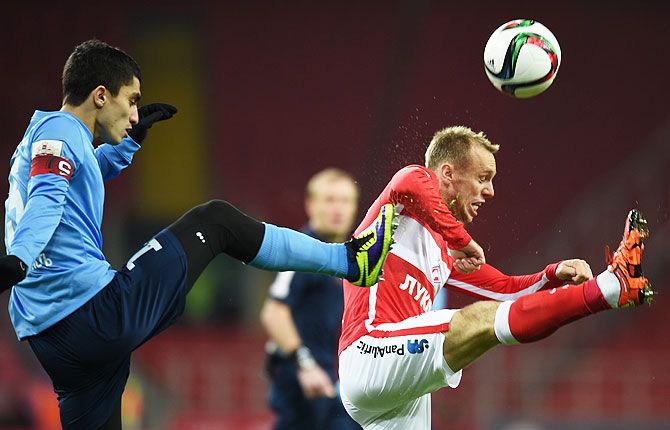 FC Spartak Moscow's Denis Glushakov (right) is challenged by FC Krylia Sovetov Samara's Ibragim Tsallagov during their Russian Premier League match at the Arena Otkritie Stadium in Moscow on December 04