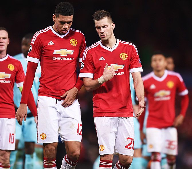 Manchester United's Chris Smalling (left) and Morgan Schneiderlin