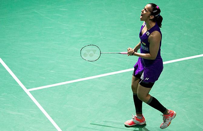 Saina Nehwal of India celebrates winning  