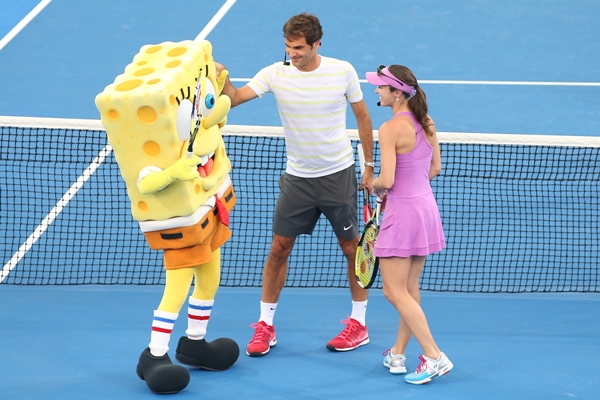 Roger Federer and Martina Hingis take part in the Pat Rafter Arena Spectacular in Brisbane 