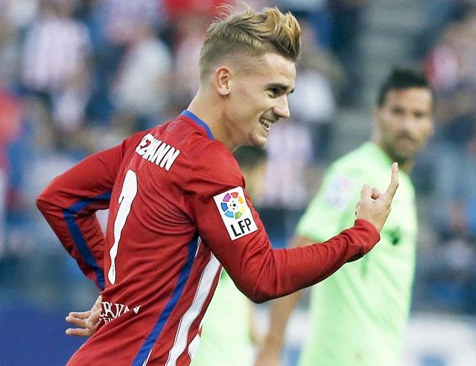 Atletico Madrid's Antoine Griezmann celebrates