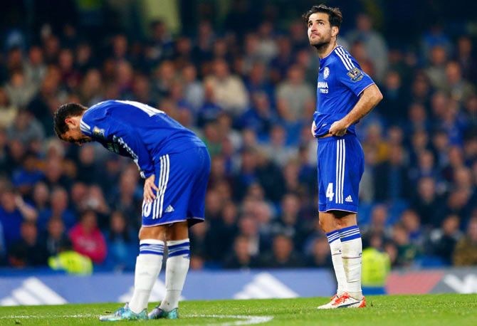 Chelsea's Eden Hazard (left) and Cesc Fabregas react during a match