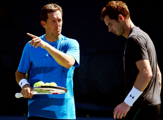 Coach Jonas Bjorkman talks with Andy Murray of Great Britain during a practice session 