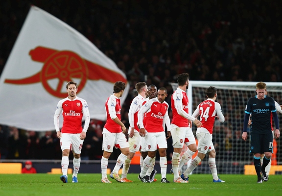 Theo Walcott of Arsenal celebrates scoring his team's first goal 
