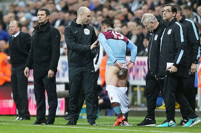 Aston Villa's Ashley Westwood changes his shorts during an English Premier League match against Newcastle United at St James' Park on Saturday