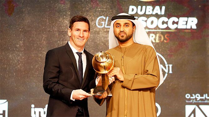 Lionel Messi accepts the Globe Sports Award in Dubai on Sunday