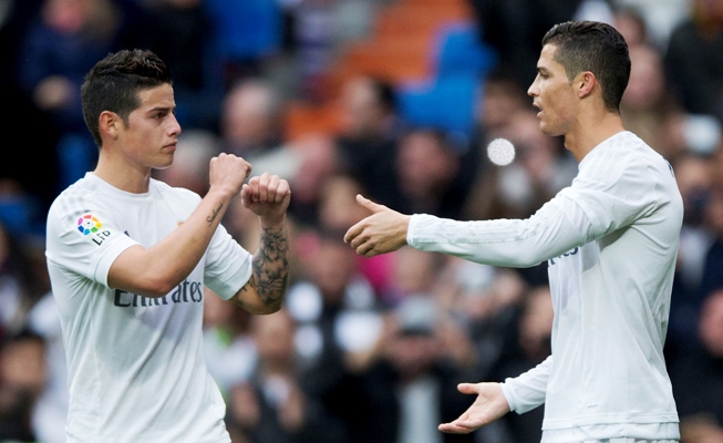 Cristiano Ronaldo (right) of Real Madrid celebrates scoring the opening goal 
