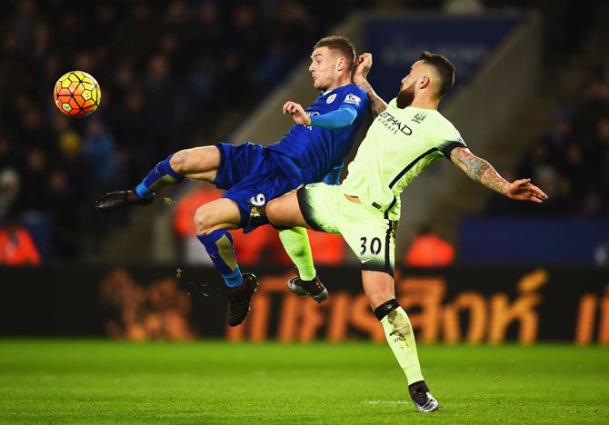 Leicester City's Jamie Vardy is challenged by Manchester City's Nicolas Otamendi during their Barclays English Premier League match at The King Power Stadium in Leicester on Tuesday