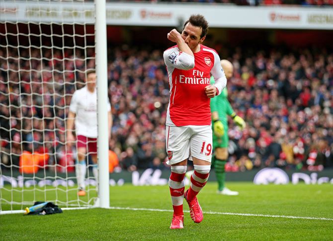 Santi Cazorla of Arsenal celebrates after scoring from the penalty spot against Aston Villa during their English Premier League match at the Emirates Stadium in London on Sunday