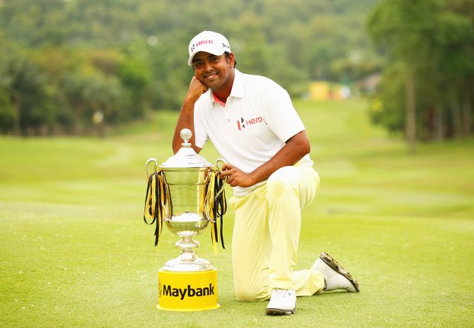 Anirban Lahiri of India poses with the trophy after victory during the final round of the Maybank Malaysian Open at Kuala Lumpur Golf & Country Club on Sunday