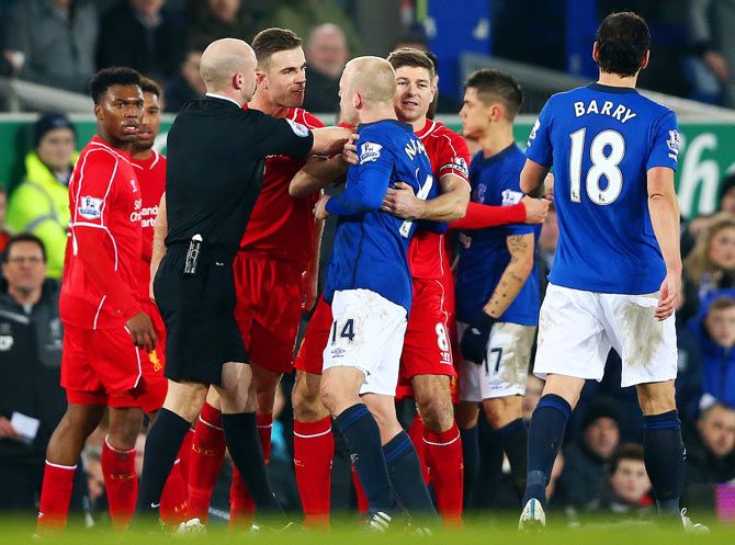 Liverpool and Everton players get into a scuffle