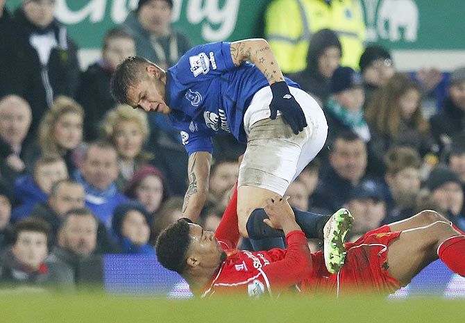 Muhamed Besic of Everton and Jordan Ibe of Liverpool are involved in a challenge