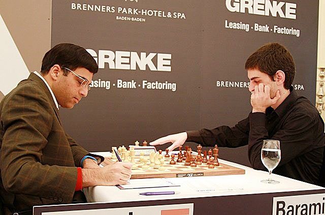 Viswanathan Anand of India takes down notes after a move against David Baramidze of Germany in the sixth round of the Grenke Chess Classic in Baden-Baden