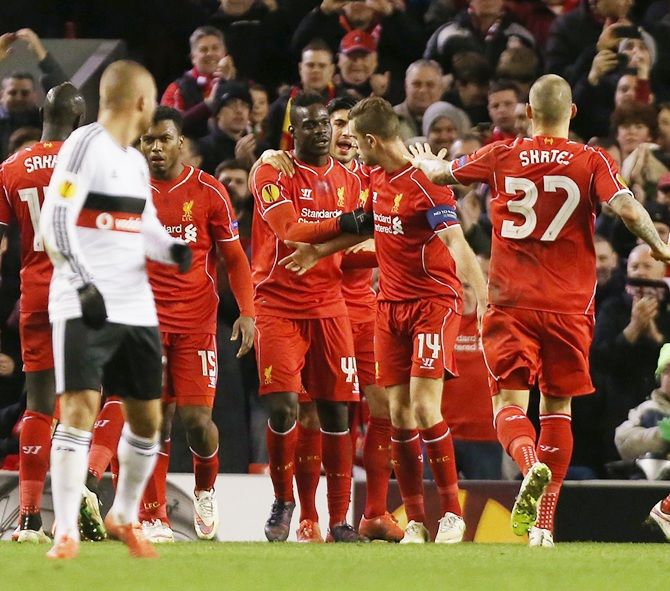 Mario Balotelli celebrates with team mates