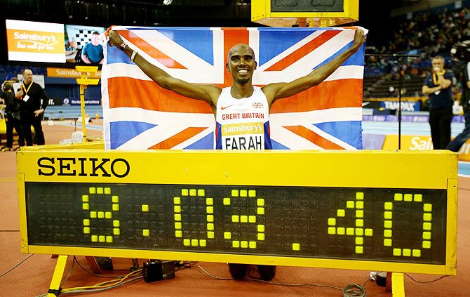 Mo Farah of Great Britain celebrates after breaking the record enroute to winning the mens 2 miles final during the Sainsbury's Indoor Grand Prix at the Barclaycard Arena in Birmingham on Saturday