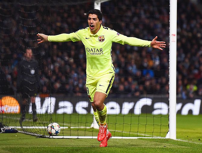 Luis Suarez of Barcelona celebrates scoring their second goal against Manchester City during the UEFA Champions League Round of 16 match at Etihad Stadium in Manchester on Tuesday