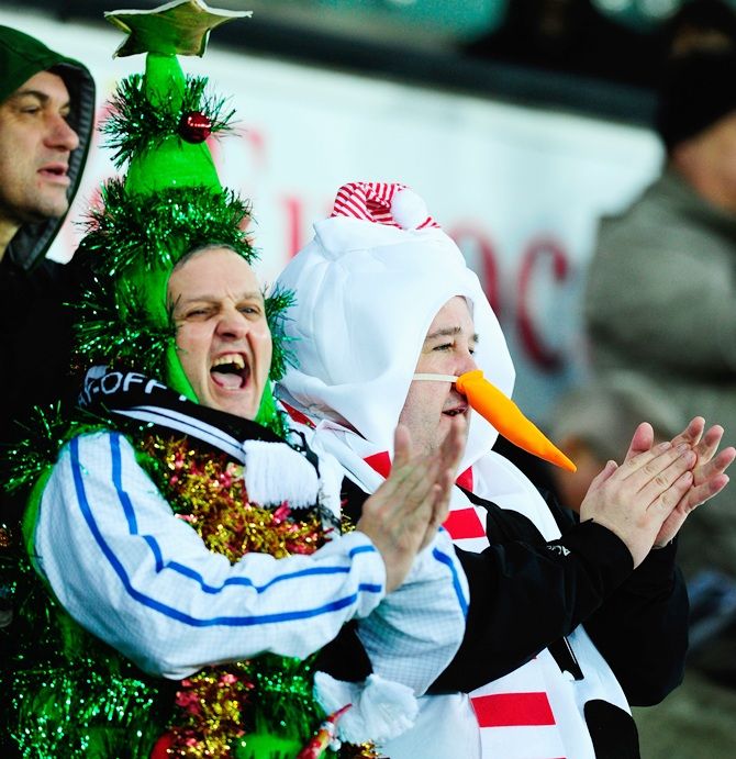 Fans dress up for the festive season during the Barclays Premier League