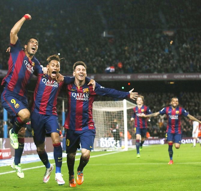 From left, Barcelona's Luis Suarez, Neymar and Lionel Messi celebrate a goal