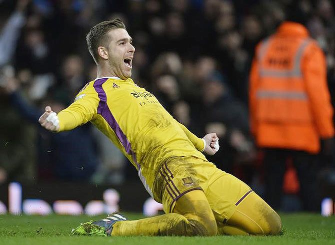 West Ham United's goalkeeper Adrian celebrates after scoring the winning penalty in a shoot out against Everton during their FA Cup third round replay match at Upton Park in London on Tuesday