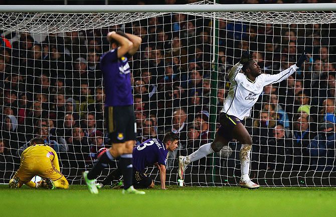 Romelu Lukaku of Everton celebrates scoring their second goal as West Ham United players wear a dejected look on Tuesday