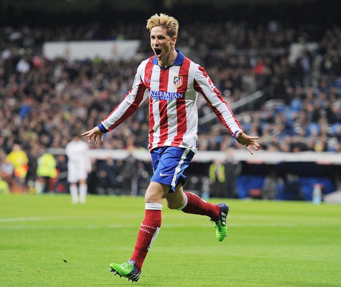 Fernando Torres of Atletico de Madrid celebrates after scoring the opening goal against Real Madrid during their Copa del Rey King's Cup round of 16, second leg match at Estadio Santiago Bernabeu in Madrid on Thursday