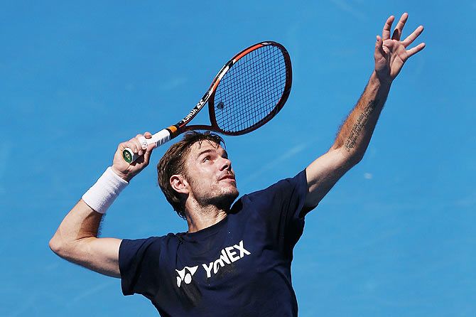 Stanislas Wawrinka of Switzerland serves during a practice session ahead of the 2015 Australian Open at Melbourne Park on Friday