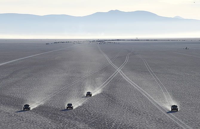 Competitors begin the 8th stage of the Dakar Rally 2015 on the Salar de Uyuni salt flat, from Uyuni to Iquique, Bolivia on January 11